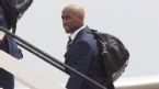 Jermain Defoe boards a plane, Luton airport, June 6, 2012